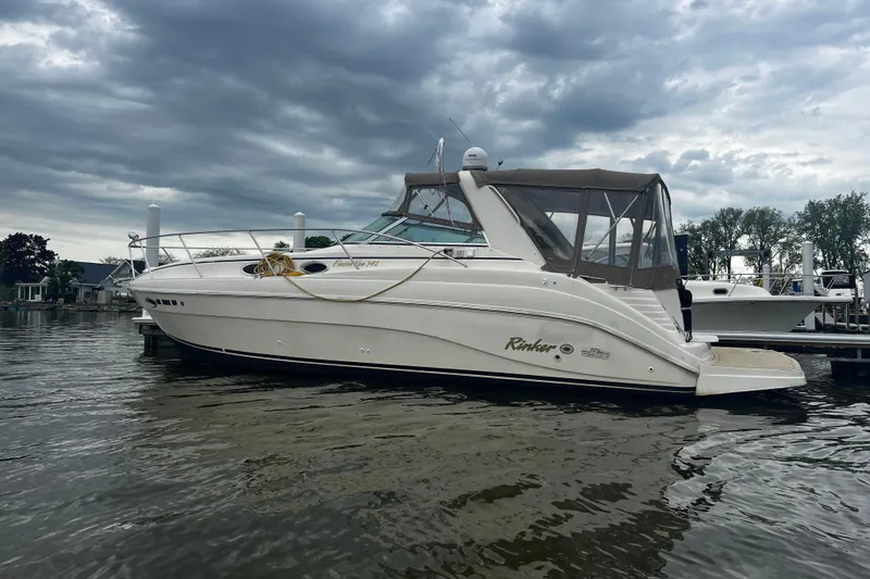 Slide: The Image of 2002 Rinker Fiesta Vee 342 boat docked under cloudy skies. - 26