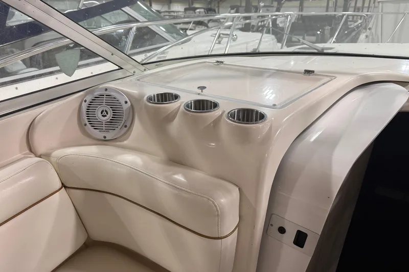 Slide: The Image of Interior of 2002 Rinker Fiesta Vee 342 boat with speaker and cup holders. - 4