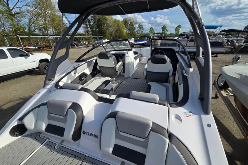 Slide: The Image of 2022 Yamaha Boats 212S interior with sleek seating and modern design. - 16