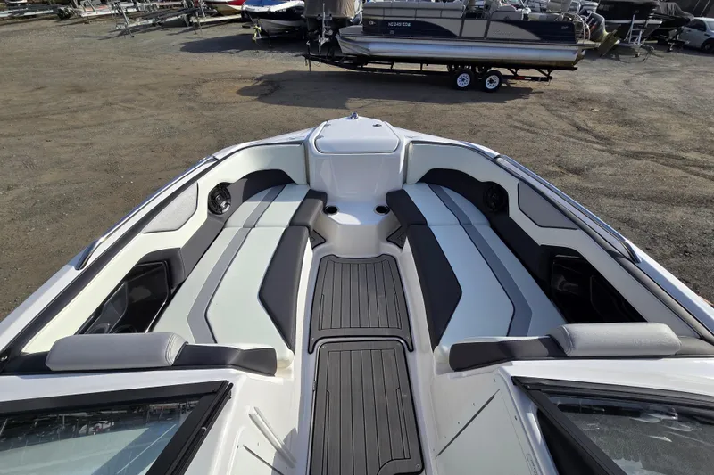 Slide: The Image of 2022 Yamaha Boats 212S interior with sleek seating and modern design. - 18