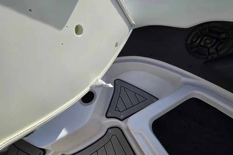 Slide: The Image of Interior view of 2022 Yamaha Boats 212S, featuring sleek design and speaker system. - 21