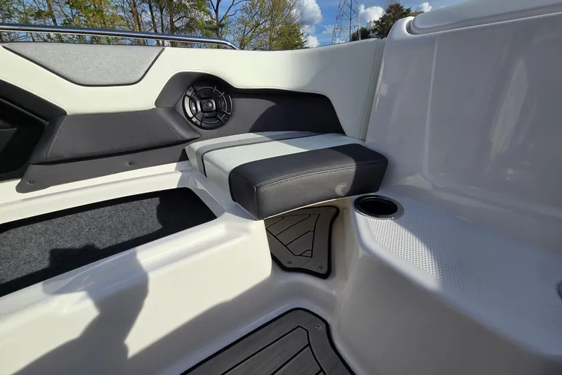 Slide: The Image of 2022 Yamaha Boats 212S interior seating with speaker and cup holder. - 24