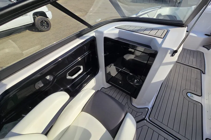 Slide: The Image of Interior view of 2022 Yamaha Boats 212S, featuring sleek seating and modern design elements. - 25