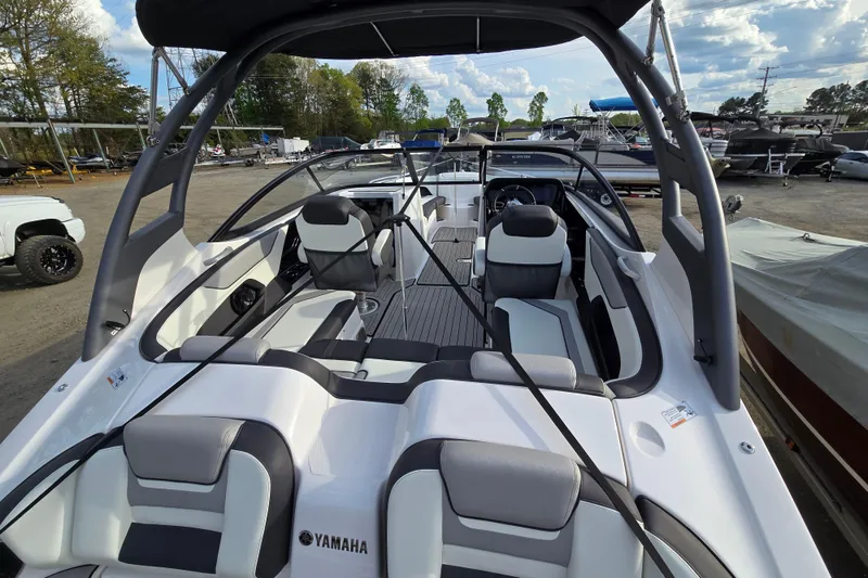 Slide: The Image of 2022 Yamaha Boats 212S interior with sleek seating and modern design. - 33