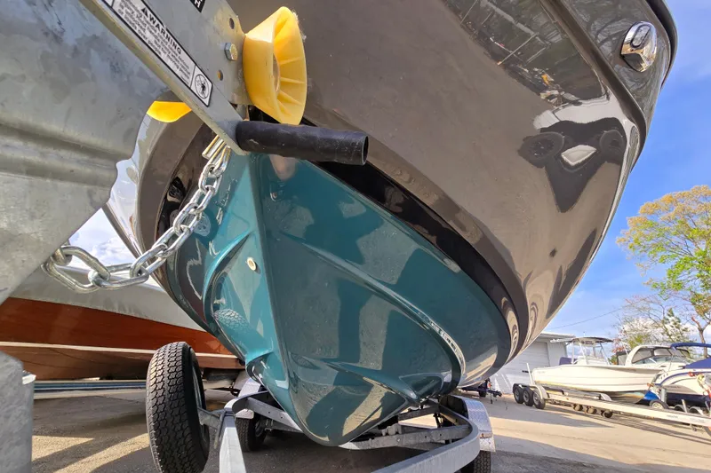 Slide: The Image of 2022 Yamaha Boats 212S on trailer, showcasing sleek hull design and vibrant color. - 4