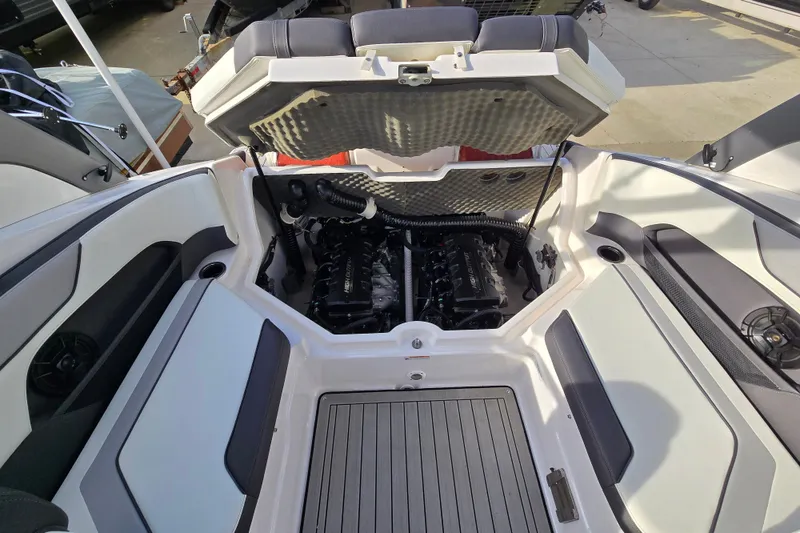 Slide: The Image of 2022 Yamaha Boats 212S engine compartment with open hatch, showcasing dual engines. - 45