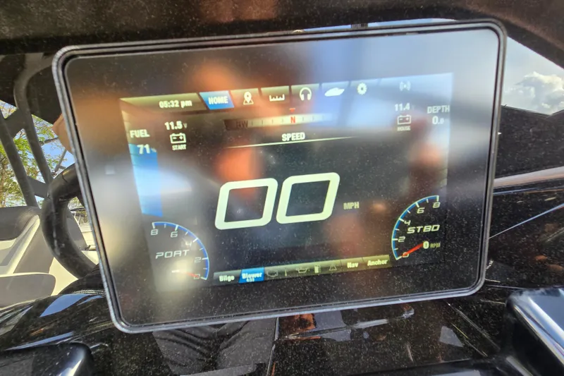 Slide: The Image of Dashboard display of a 2022 Yamaha Boats 212S showing speed and fuel levels. - 47