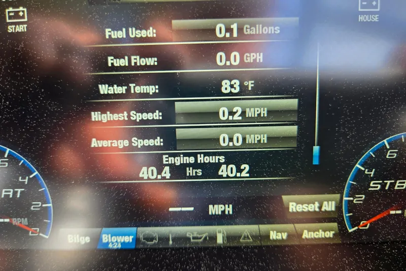 Slide: The Image of Dashboard display of a 2022 Yamaha Boats 212S showing fuel, speed, and engine hours. - 48