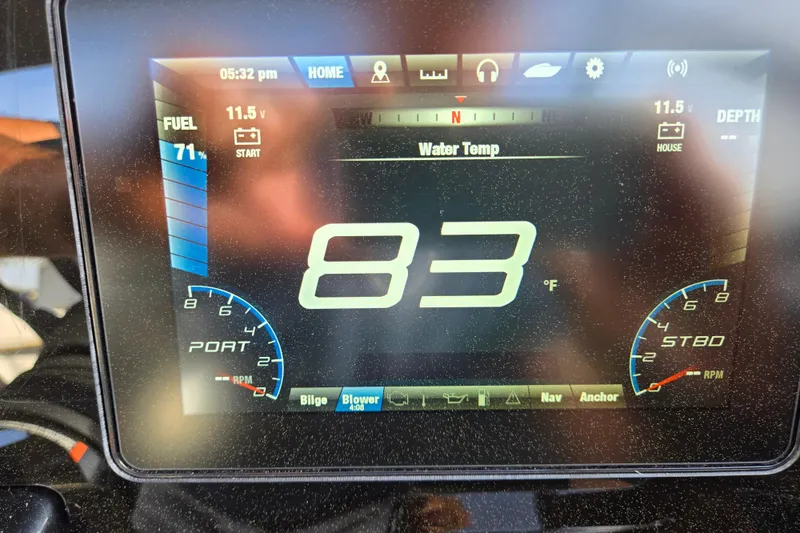 Slide: The Image of Yamaha Boats 212S 2022 dashboard displaying water temperature at 83°F. - 50