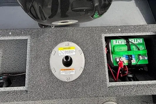 Slide: The Image of 2024 Lund 1650 Rebel XL Sport boat interior with battery compartment and motor mount. - 29