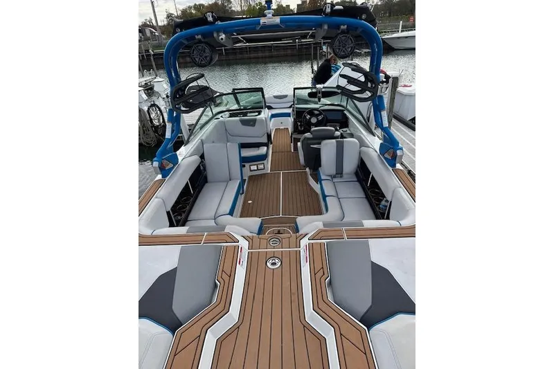 Slide: The Image of 2018 Nautique Super Air Nautique GS22 boat interior with sleek seating and modern design. - 5