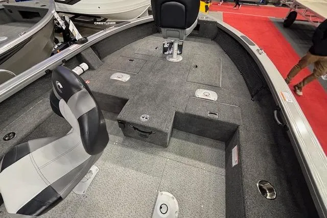Slide: The Image of 2026 Crestliner 1850 Pro Tiller boat interior with seating and storage compartments. - 16