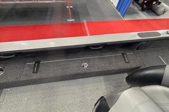 Slide: The Image of 2026 Crestliner 1850 Pro Tiller boat interior with red carpet and seating. - 18