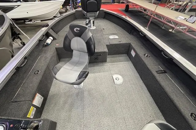 Slide: The Image of 2026 Crestliner 1850 Pro Tiller boat interior with seating and storage compartments. - 19