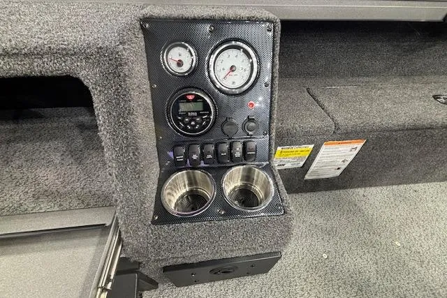 Slide: The Image of Dashboard of 2026 Crestliner 1850 Pro Tiller boat with gauges and cup holders. - 21