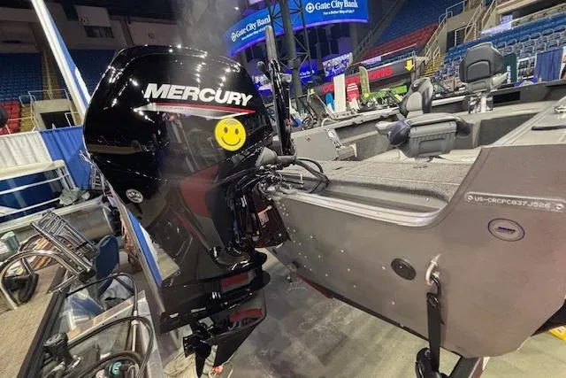 Slide: The Image of 2026 Crestliner 1850 Pro Tiller boat with Mercury outboard motor at indoor exhibition. - 26