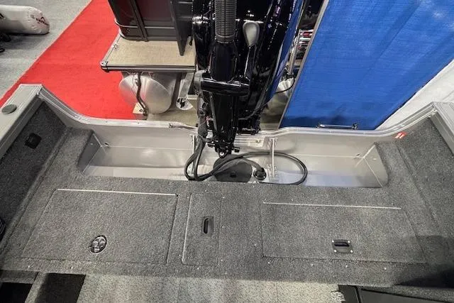 Slide: The Image of 2026 Crestliner 1850 Pro Tiller boat interior with motor and storage compartments. - 5