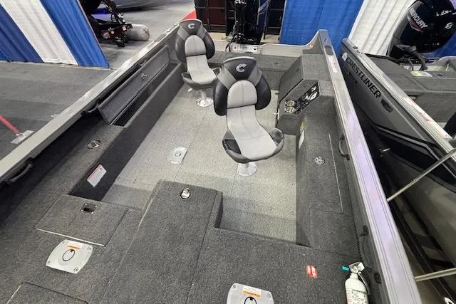 Slide: The Image of 2026 Crestliner 1850 Pro Tiller boat interior with two seats and carpeted flooring. - 8