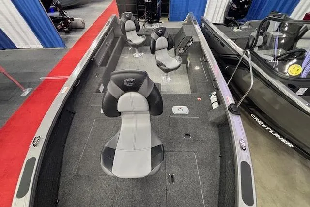 Slide: The Image of 2026 Crestliner 1850 Pro Tiller boat interior with three seats and carpeted flooring. - 9