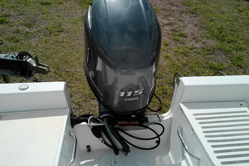 Slide: The Image of 2018 Sportsman Island Reef 19 Center Console with Yamaha 115 outboard motor. - 6