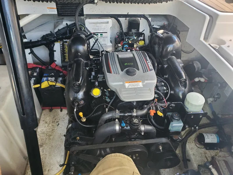 Slide: The Image of Engine compartment of a 2013 Crownline 264 CR boat with MerCruiser engine. - 12