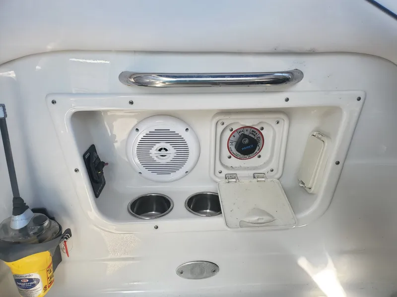 Slide: The Image of Crownline 264 CR 2013 boat console with speaker and controls. - 14