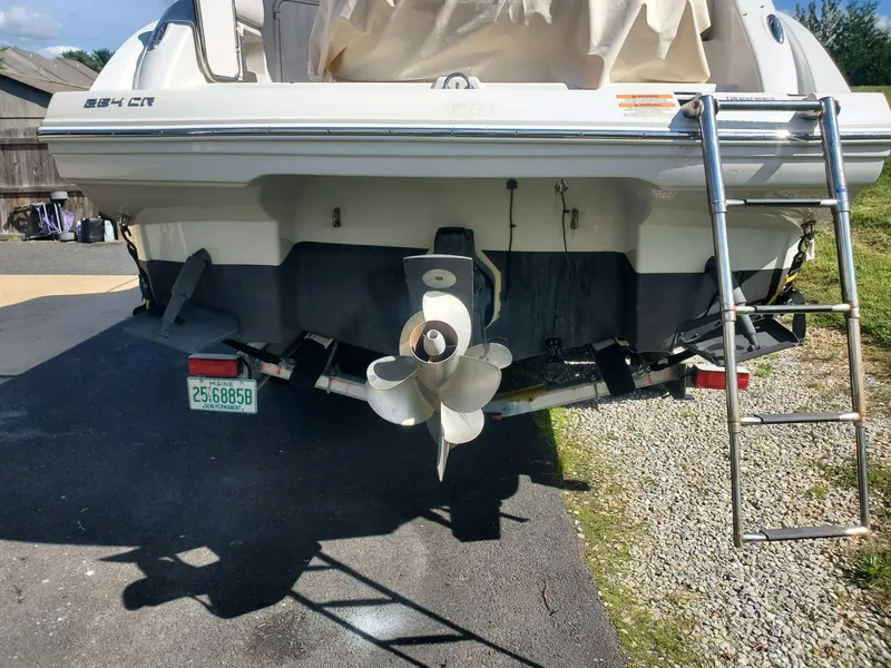 Slide: The Image of Rear view of a 2013 Crownline 264 CR boat with ladder and propeller. - 6