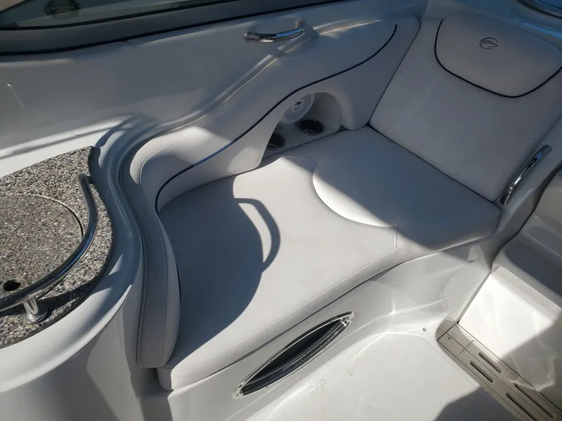 Slide: The Image of Interior of 2013 Crownline 264 CR with white seating area. - 9