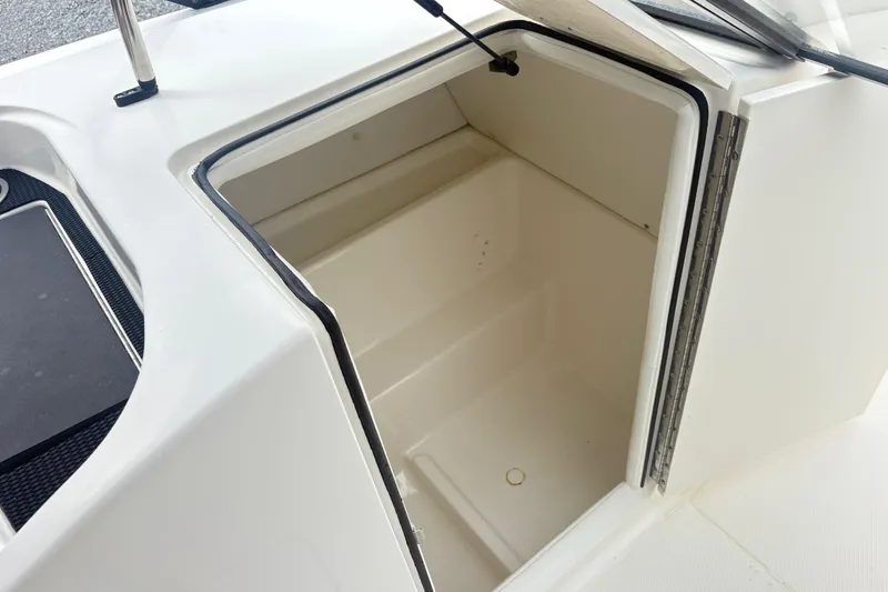 Slide: The Image of Open storage compartment on 2022 Bayliner VR6 Bowrider OB boat. - 13