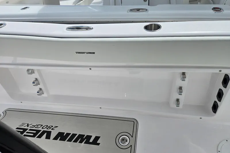 Slide: The Image of 2026 Twin Vee 280 GFX2 CC boat interior with sleek white finish and modern fittings. - 17