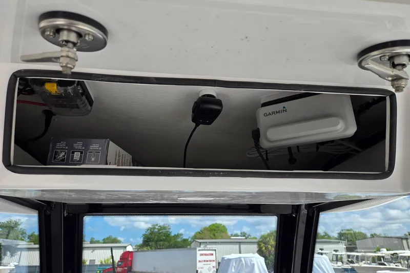 Slide: The Image of Storage compartment in 2026 Twin Vee 280 GFX2 CC boat with Garmin equipment. - 19