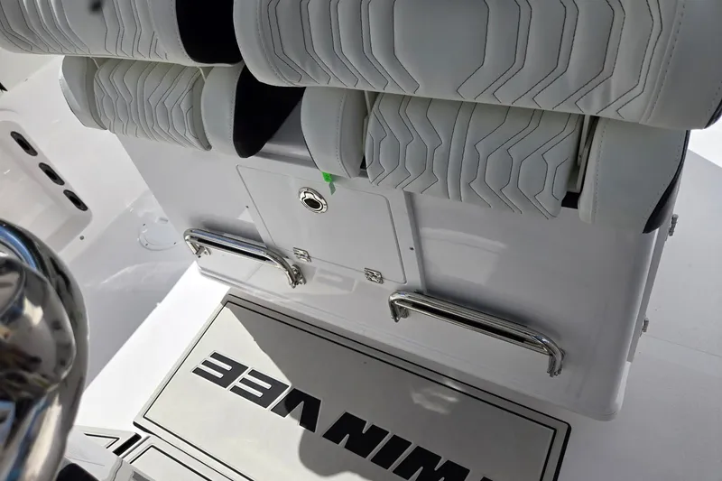 Slide: The Image of Interior view of 2026 Twin Vee 280 GFX2 CC boat with white seating and branding. - 23