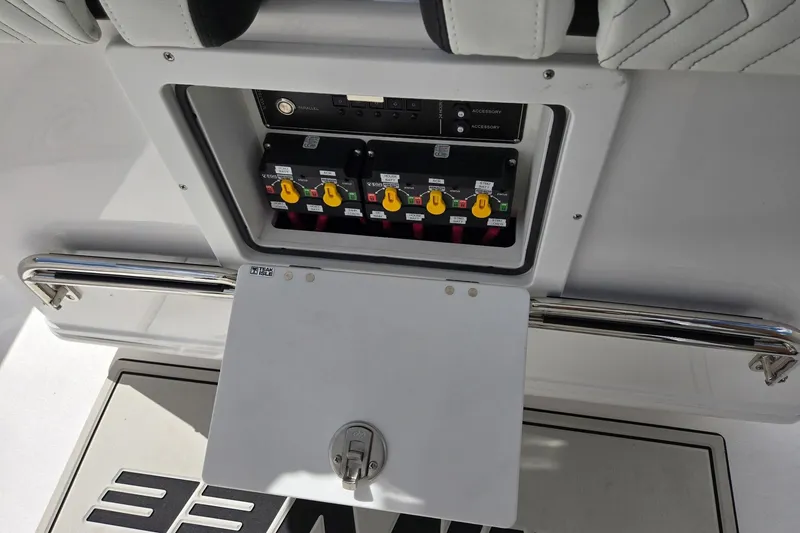 Slide: The Image of Electrical panel on a 2026 Twin Vee 280 GFX2 CC boat, featuring labeled switches. - 24