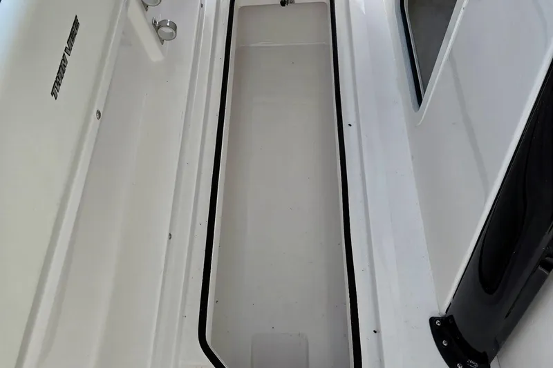 Slide: The Image of 2026 Twin Vee 280 GFX2 CC boat interior storage compartment, white finish. - 27