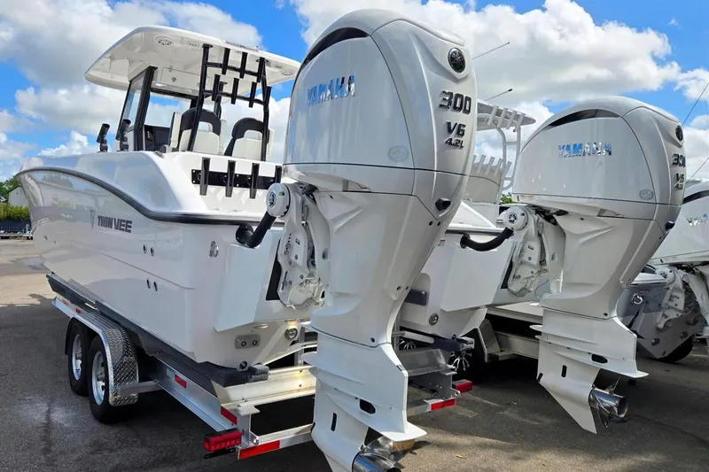 Slide: The Image of 2026 Twin Vee 280 GFX2 CC boat with dual Yamaha 300 V6 engines on trailer. - 3