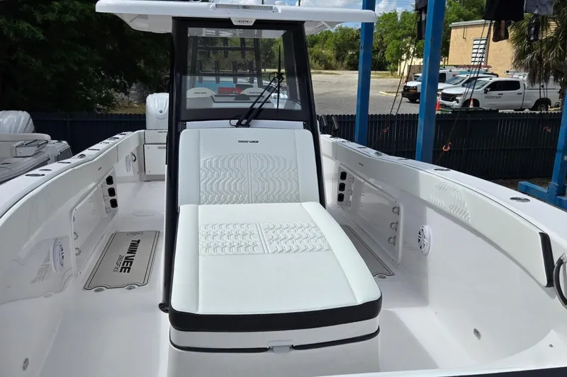Slide: The Image of 2026 Twin Vee 280 GFX2 CC boat interior with white seating and modern design. - 4
