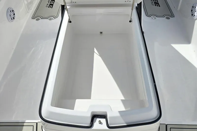 Slide: The Image of 2026 Twin Vee 280 GFX2 CC boat storage compartment, open and empty, with sleek design. - 5
