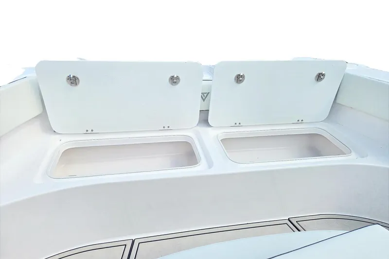 Slide: The Image of 2026 Twin Vee 280 GFX2 CC boat storage compartments with open lids. - 7