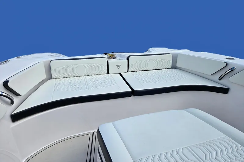 Slide: The Image of 2026 Twin Vee 280 GFX2 CC boat interior with white cushioned seating. - 8