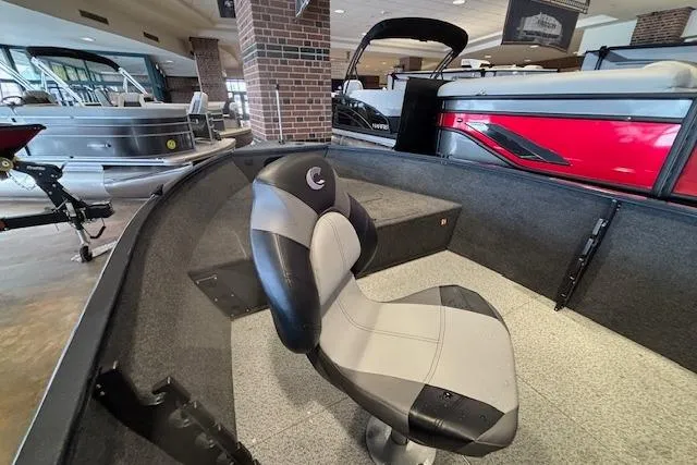 Slide: The Image of 2026 Crestliner 1650 Kodiak Tiller boat interior with seating in showroom. - 11