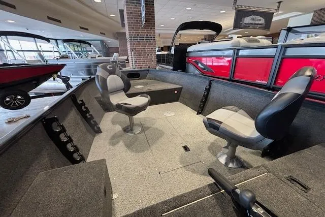 Slide: The Image of Interior of 2026 Crestliner 1650 Kodiak Tiller boat with seating and storage. - 12