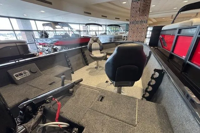 Slide: The Image of 2026 Crestliner 1650 Kodiak Tiller boat interior with seating and control panel. - 15