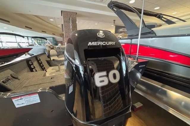 Slide: The Image of 2026 Crestliner 1650 Kodiak Tiller with Mercury 60 HP engine in showroom. - 16