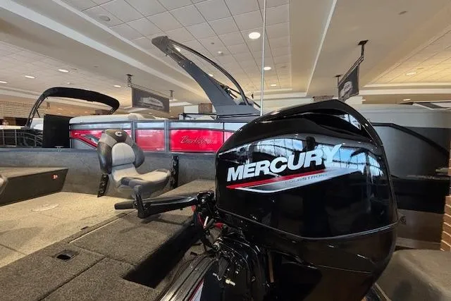 Slide: The Image of 2026 Crestliner 1650 Kodiak Tiller boat with Mercury engine displayed indoors. - 17