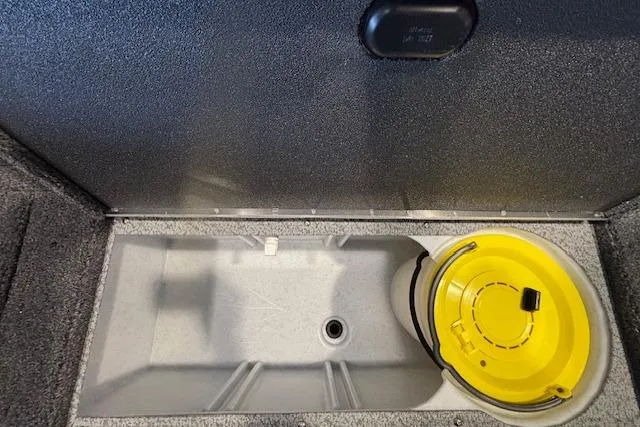 Slide: The Image of 2026 Crestliner 1650 Kodiak Tiller storage compartment with yellow bucket. - 5