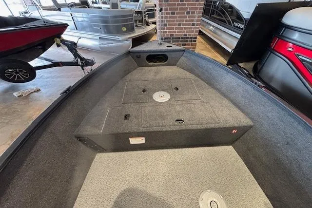 Slide: The Image of 2026 Crestliner 1650 Kodiak Tiller boat interior, showcasing spacious deck and storage compartments. - 6