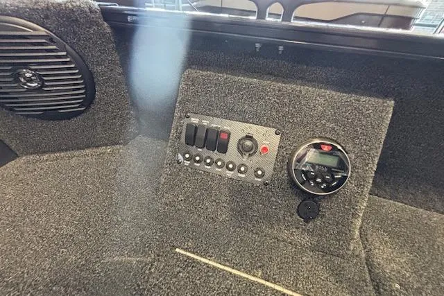 Slide: The Image of 2026 Crestliner 1650 Kodiak Tiller dashboard with control panel and speaker. - 7