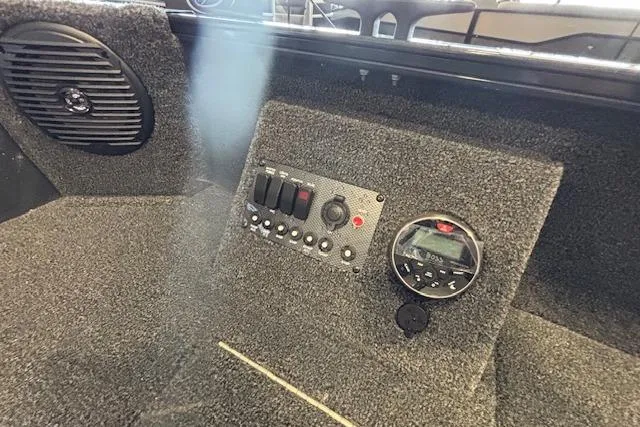 Slide: The Image of Control panel of 2026 Crestliner 1650 Kodiak Tiller boat with speaker and gauge. - 8
