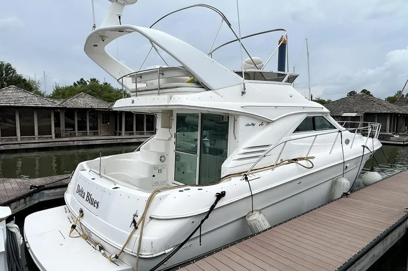 Slide: The Image of 1999 Sea Ray 400 Sedan Bridge yacht docked at marina, rear view. - 12