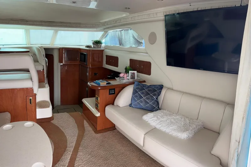 Slide: The Image of Luxurious interior of a 1999 Sea Ray 400 Sedan Bridge yacht with modern amenities. - 23